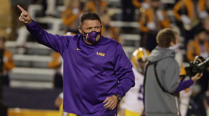 Dec 5, 2020; Baton Rouge, Louisiana, USA; LSU Tigers head coach Ed Orgeron watches warm ups prior to kickoff against the Alabama Crimson Tide at Tiger Stadium.